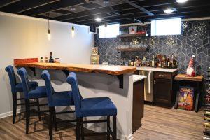 Finished basement home bar with custom wood countertop in Farmington Hills, Michigan