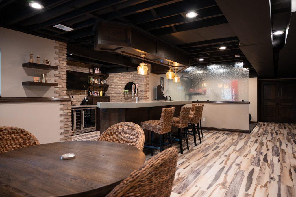 Finished basement view from the dining room area to the home bar.