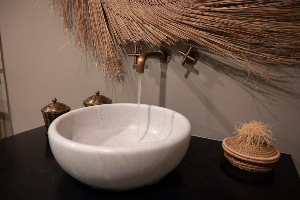 Closeup look at the a bowl sink on top of the vanity in the bathroom.