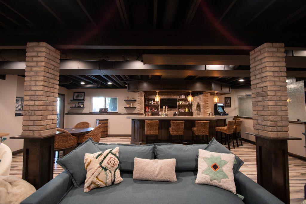 Finished basement view from the tv looking towards the bar and dining area.