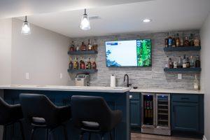 Finished basement ledgestone backsplash in home bar in New Hudson, Michigan