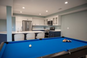 Finished basement with kitchen and game area in White Lake, Michigan