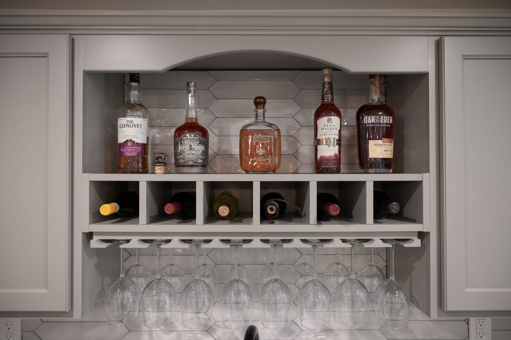 Hanging wine rack with shelf storage above for alcohol and other items