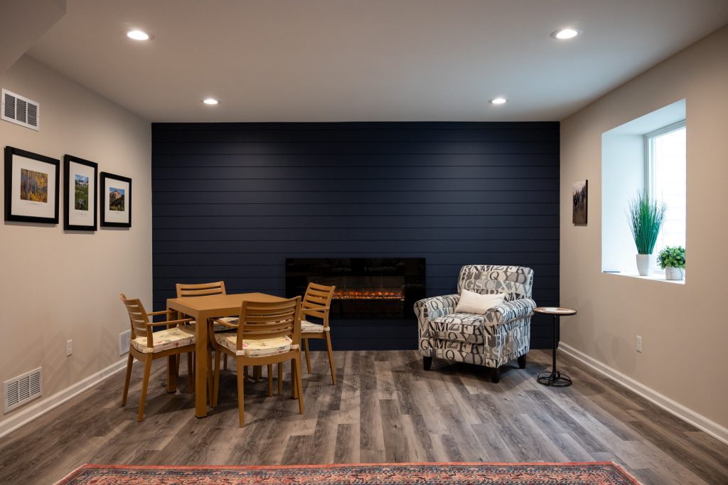 Finished Basement With Accent Wall Fireplace And Bathroom In Saline Mi Basements Plus